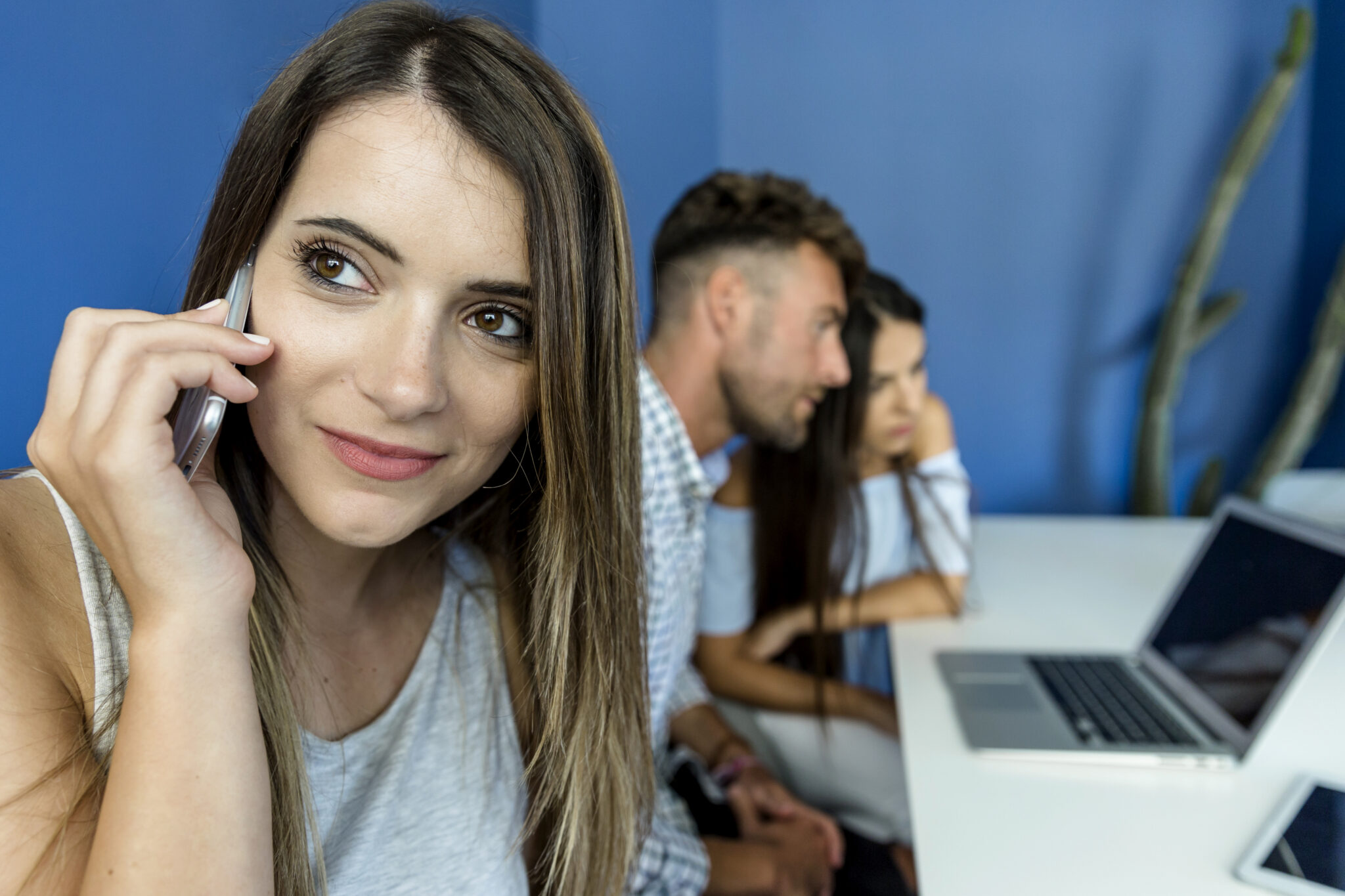 close-up with a young woman talking at the support company